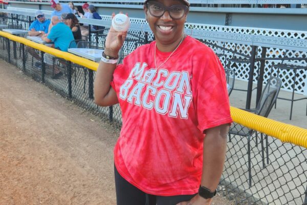 Eleyce Coleman, Existing Industry Manager at MBCIA, prepares to throw out the first pitch at the Macon Bacon game on Thursday, July 13, 2023.